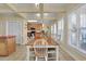 Spacious dining area with a long table and view of the kitchen, ideal for Gathering gatherings and everyday meals at 156 Via Old Sound Blvd. # C, Ocean Isle Beach, NC 28469