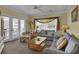 Comfortable living room with plush seating, neutral tones, and natural light for relaxing after a beach day at 156 Via Old Sound Blvd. # C, Ocean Isle Beach, NC 28469