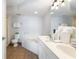 Bathroom featuring a jacuzzi tub, dual sinks, and ample counter space at 1707 Perrin Dr. # 1003, North Myrtle Beach, SC 29582