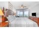 Bedroom with beach views, ceiling fan, woven-wood headboard and neutral coastal colors at 1707 Perrin Dr. # 1003, North Myrtle Beach, SC 29582