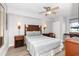 Well-lit bedroom with traditional decor, ceiling fan, and light wood flooring at 1707 Perrin Dr. # 1003, North Myrtle Beach, SC 29582
