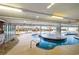 Large, uniquely shaped indoor pool that looks like a lazy river, surrounded by seating and a shallow water entrance at 1707 Perrin Dr. # 1003, North Myrtle Beach, SC 29582