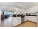 Modern kitchen with stainless appliances, granite countertops, and an open view into living area at 1707 Perrin Dr. # 1003, North Myrtle Beach, SC 29582