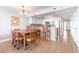 Open kitchen and dining area with updated appliances, a kitchen bar, and seating for six at 1707 Perrin Dr. # 1003, North Myrtle Beach, SC 29582
