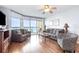 Bright living room with comfortable seating and ocean views through sliding glass doors to balcony at 1707 Perrin Dr. # 1003, North Myrtle Beach, SC 29582