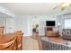 Living room leading to open concept dining room and kitchen with view to ocean at 1707 Perrin Dr. # 1003, North Myrtle Beach, SC 29582