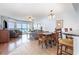 Open concept living room with dining table, chairs, and a glimpse of the ocean at 1707 Perrin Dr. # 1003, North Myrtle Beach, SC 29582