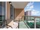Relax on this condo's private balcony with seating and ocean views, perfect for enjoying the coastal scenery at 1707 Perrin Dr. # 802, North Myrtle Beach, SC 29582