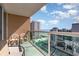 This balcony features clear glass railings, providing unobstructed views of the ocean and surrounding coastal community at 1707 Perrin Dr. # 802, North Myrtle Beach, SC 29582