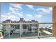 Private condo balcony featuring clear glass railings, providing beautiful views of the surrounding coastal area at 1707 Perrin Dr. # 802, North Myrtle Beach, SC 29582