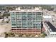 High-rise condo building with multiple balconies overlooking the ocean and surrounding cityscape at 1707 Perrin Dr. # 802, North Myrtle Beach, SC 29582