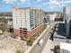 Modern condo building with parking garage and ocean views, conveniently located near local streets at 1707 Perrin Dr. # 802, North Myrtle Beach, SC 29582
