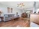 Inviting living room with hardwood and tile flooring, comfortable seating, and kitchen views at 1707 Perrin Dr. # 802, North Myrtle Beach, SC 29582