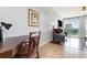 Comfortable seating area featuring a desk, soft chair, tv, and a sliding door with access to a balcony at 1707 Perrin Dr. # 802, North Myrtle Beach, SC 29582