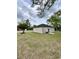 Backyard view of a home with neutral siding and a black roof at 1795 Hemingway St., Conway, SC 29527