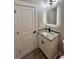 Bathroom featuring granite vanity with cabinet and unique mirror at 1795 Hemingway St., Conway, SC 29527