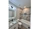 Bathroom featuring vanity, tub with tile surround, and wood look flooring at 1795 Hemingway St., Conway, SC 29527
