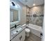 Bathroom featuring granite vanity, tub with tile surround, and wood look flooring at 1795 Hemingway St., Conway, SC 29527