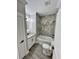 Bathroom featuring granite vanity, tub with tile surround, and wood look flooring at 1795 Hemingway St., Conway, SC 29527