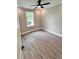 Cozy bedroom featuring a window, a ceiling fan, and wood-look flooring at 1795 Hemingway St., Conway, SC 29527