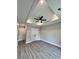 Spacious bedroom featuring wood-look flooring, a tray ceiling with recessed lights, and a ceiling fan at 1795 Hemingway St., Conway, SC 29527