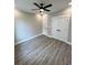 Spacious bedroom featuring modern ceiling fan, light grey walls and wood-look flooring at 1795 Hemingway St., Conway, SC 29527