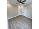 Bedroom with a ceiling fan and two doors, wood-look flooring at 1795 Hemingway St., Conway, SC 29527