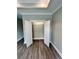 Walk-in closet with double doors, a shelf, and modern wood-look flooring at 1795 Hemingway St., Conway, SC 29527
