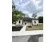 Charming home featuring a well-manicured lawn, walkway, and black door at 1795 Hemingway St., Conway, SC 29527