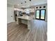 Modern kitchen with granite island, stainless appliances, and French doors to the exterior at 1795 Hemingway St., Conway, SC 29527