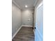 Practical laundry room featuring sleek wood-look floors and neutral wall color at 1795 Hemingway St., Conway, SC 29527