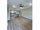 Bright and airy living space featuring wood-look floors, ceiling fan and neutral walls at 1795 Hemingway St., Conway, SC 29527