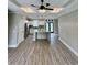 Open concept living area with wood-look floors, large kitchen island and modern lighting at 1795 Hemingway St., Conway, SC 29527