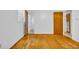 This cozy bedroom features hardwood floors, white walls, and a door to the bathroom at 1907 Rose St., Conway, SC 29527