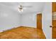 This cozy bedroom features hardwood floors, white walls, and a ceiling fan at 1907 Rose St., Conway, SC 29527