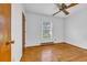 Cozy bedroom featuring gleaming hardwood floors, a large window, and neutral walls at 1907 Rose St., Conway, SC 29527