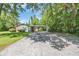 A charming home with a long driveway, covered parking and plentiful green trees at 1907 Rose St., Conway, SC 29527