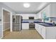 Clean kitchen with stainless steel appliances, white cabinetry, and blue countertops at 1907 Rose St., Conway, SC 29527