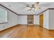 The living room boasts hardwood floors, a brick fireplace, and natural light at 1907 Rose St., Conway, SC 29527