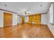 Spacious room with hardwood floors and built-in shelving, perfect for entertaining or relaxation at 1907 Rose St., Conway, SC 29527