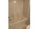 Clean white bathtub with a shower head and pastel wallpaper in the bathroom at 193 Charter Dr. # E3, Longs, SC 29568
