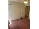 Bedroom featuring a double door closet, ceiling fan, and doorway leading to the bathroom at 193 Charter Dr. # E3, Longs, SC 29568