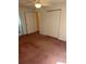 Bedroom featuring a ceiling fan, closet doors, and doorway that leads to the bathroom at 193 Charter Dr. # E3, Longs, SC 29568