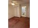 This bedroom features a ceiling fan and closet, with a bathroom connected and carpeted flooring at 193 Charter Dr. # E3, Longs, SC 29568