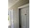 Exterior entrance showcases gray siding, white doors, and unit E3, adding charm to the property at 193 Charter Dr. # E3, Longs, SC 29568