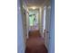 Hallway with carpeted floor, white doors, and neutral wall colors leading to other rooms at 193 Charter Dr. # E3, Longs, SC 29568