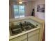 Kitchen sink with an exterior view of the porch for convenient food prep and cleanup at 193 Charter Dr. # E3, Longs, SC 29568