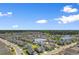 Aerial view of a residential community with pond and homes, 194 Zostera Dr. highlighted at 194 Zostera Dr., Little River, SC 29566