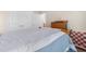 Bright bedroom with hardwood furniture, neutral walls, and soft blue bedding for a relaxing atmosphere at 194 Zostera Dr., Little River, SC 29566