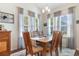 Elegant dining room with natural light and a dining set at 194 Zostera Dr., Little River, SC 29566